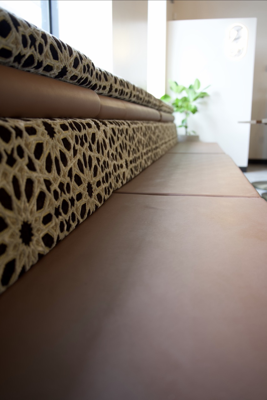 Leather banquette with Islamic geometric upholstery